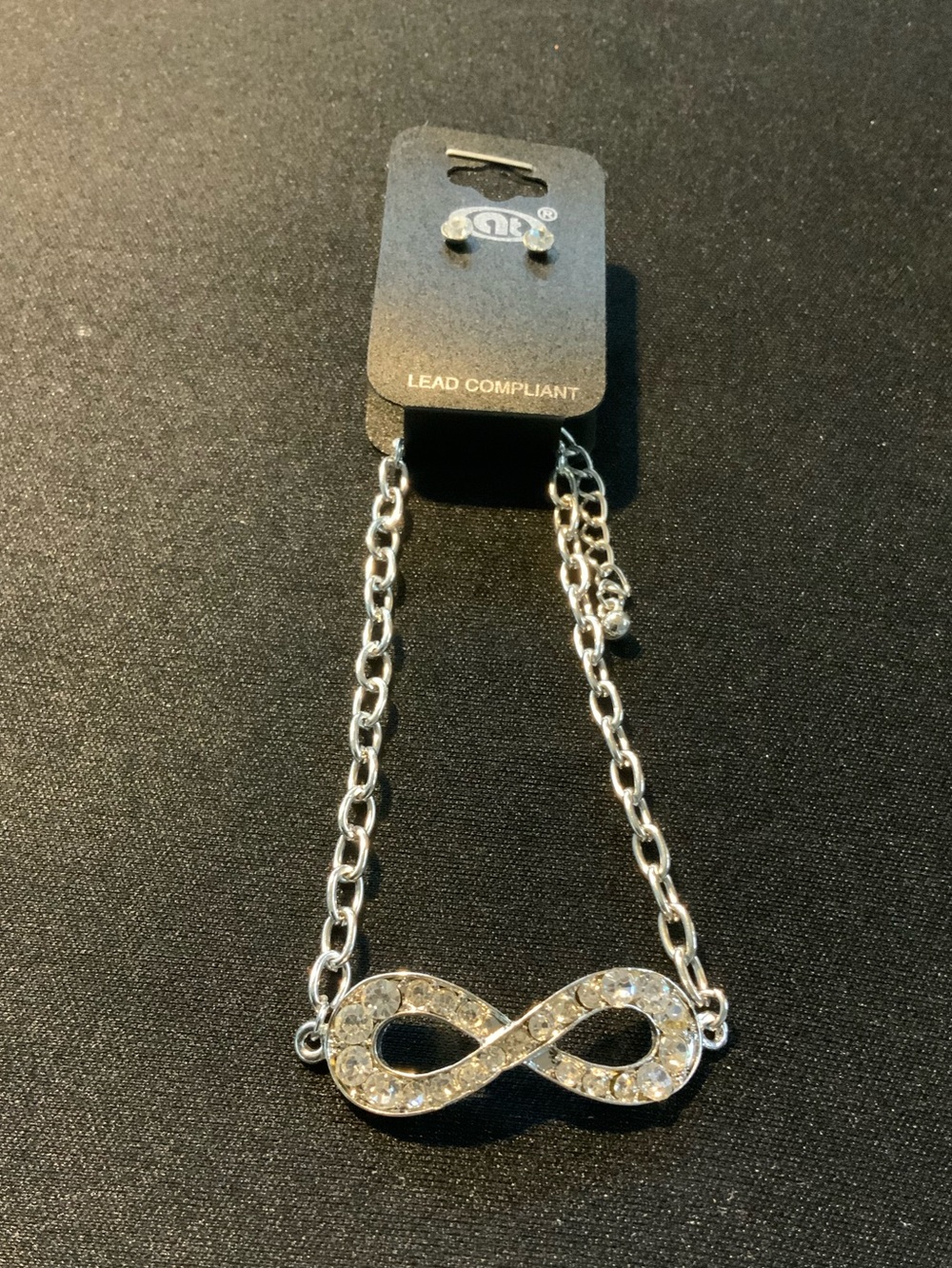 Silver Infinity Pendant Necklace and Earrings with Clear Crystals
